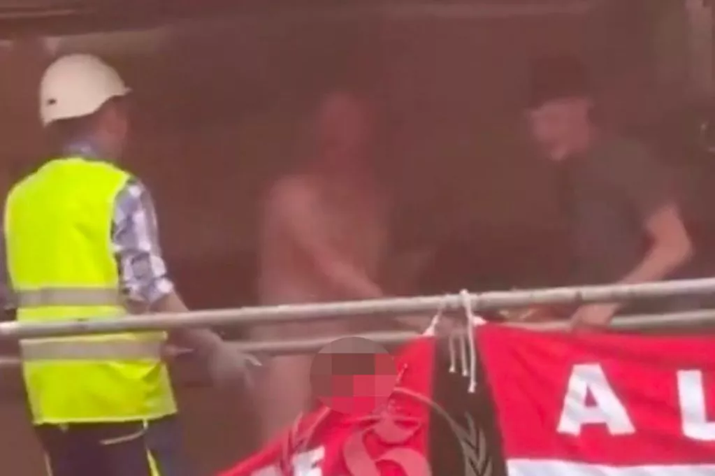 Naked United Fan On Bilbao Scaffolding Sparks Worker Confrontation