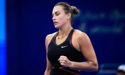 Aryna Sabalenka celebrates after defeating Rebecca Sramkova in a three-set comeback win at the Wuhan Open 2025.