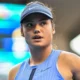 Emma Raducanu in action during a tennis match