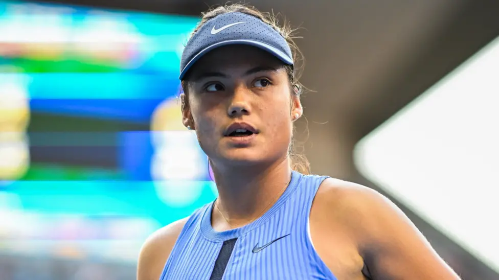 Emma Raducanu in action during a tennis match