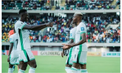 Victor Osimhen celebrates with Gift Adams after scoring on his Super Eagles debut