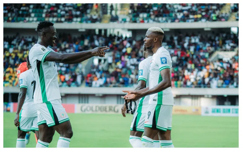 Victor Osimhen celebrates with Gift Adams after scoring on his Super Eagles debut