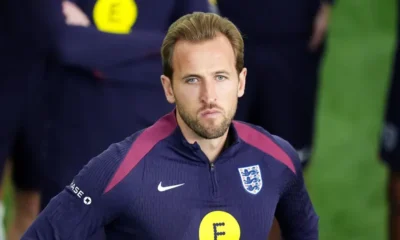 Harry Kane holding his ankle in pain during a Bayern Munich match as England confirm he will miss the Wales friendly.