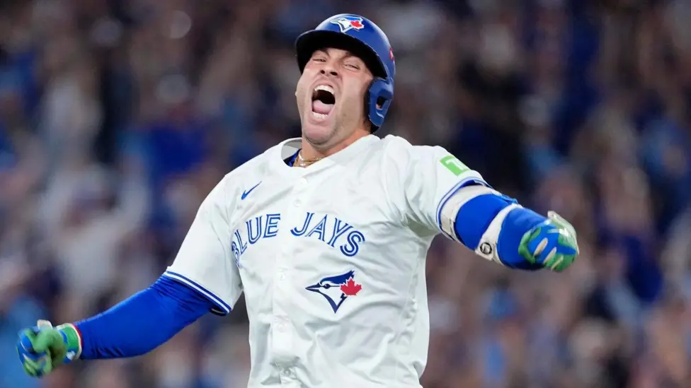 Toronto Blue Jays players celebrate Game 7 victory over Seattle Mariners