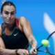 Aryna Sabalenka celebrates victory at the Wuhan Open after extending her winning streak to 20 matches.
