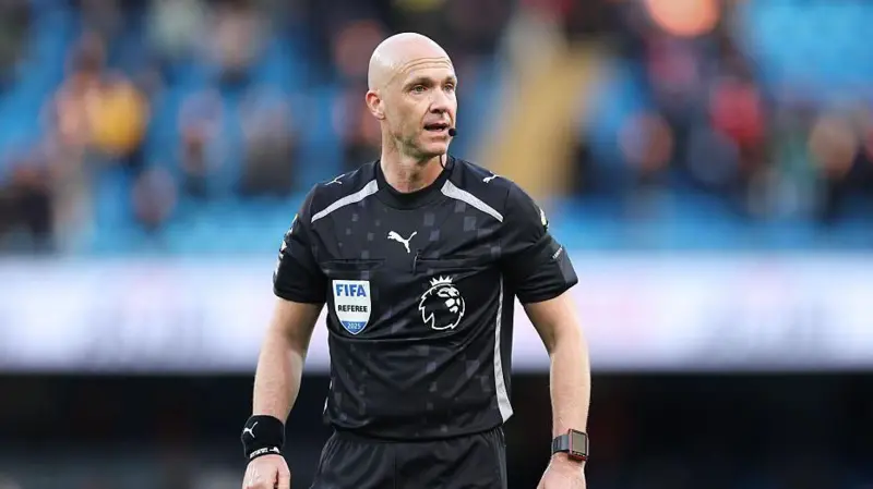 Premier League referee Anthony Taylor officiating a match in England.