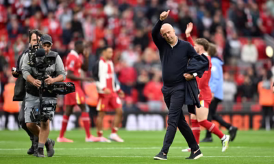 Arne Slot on the touchline during a Liverpool match, gesturing passionately