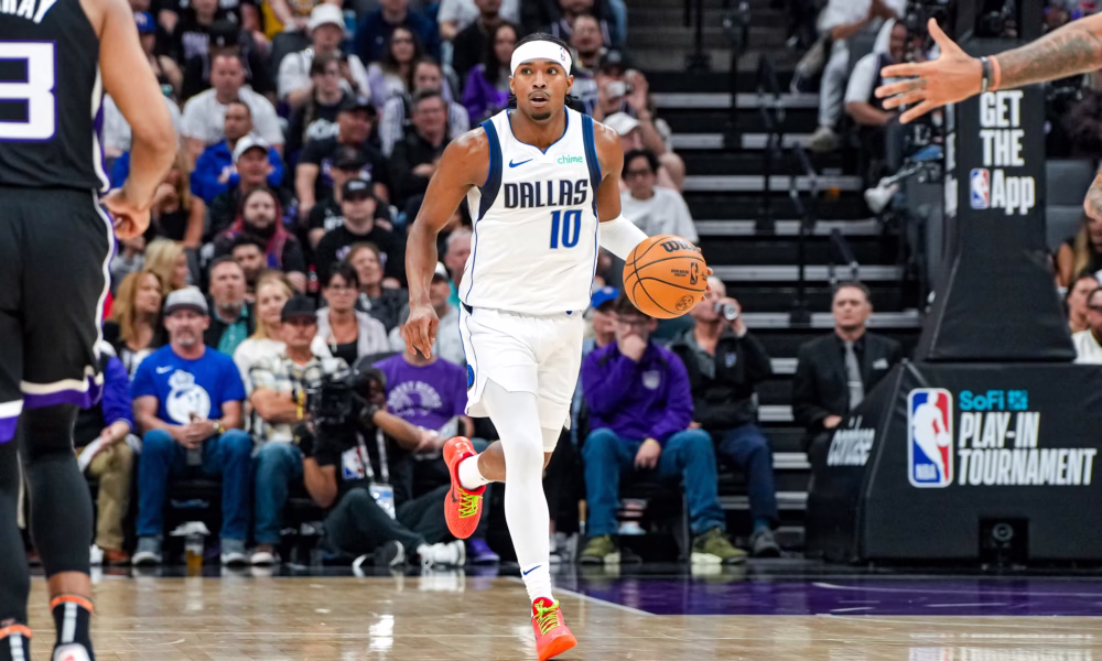 Brandon Williams of the Dallas Mavericks dribbles the ball during an NBA game at the American Airlines Center.