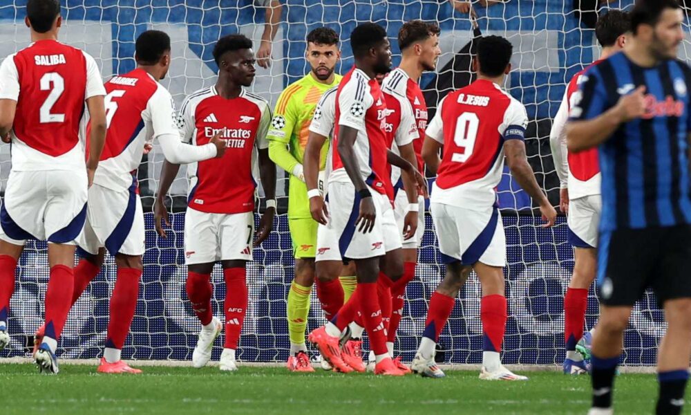 David Raya celebrating Arsenal’s Champions League win with teammates.