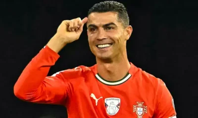 Cristiano Ronaldo holding the Globo de Prestigio trophy at Portugal Football Globe gala, expressing his passion for the national team.