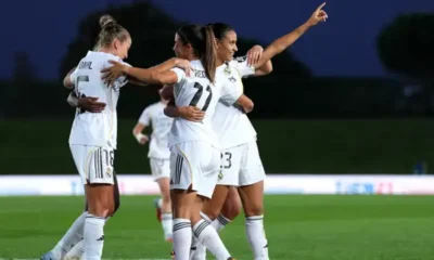 Real Madrid and Barcelona players facing off during a Liga F women’s football match