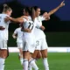 Real Madrid and Barcelona players facing off during a Liga F women’s football match