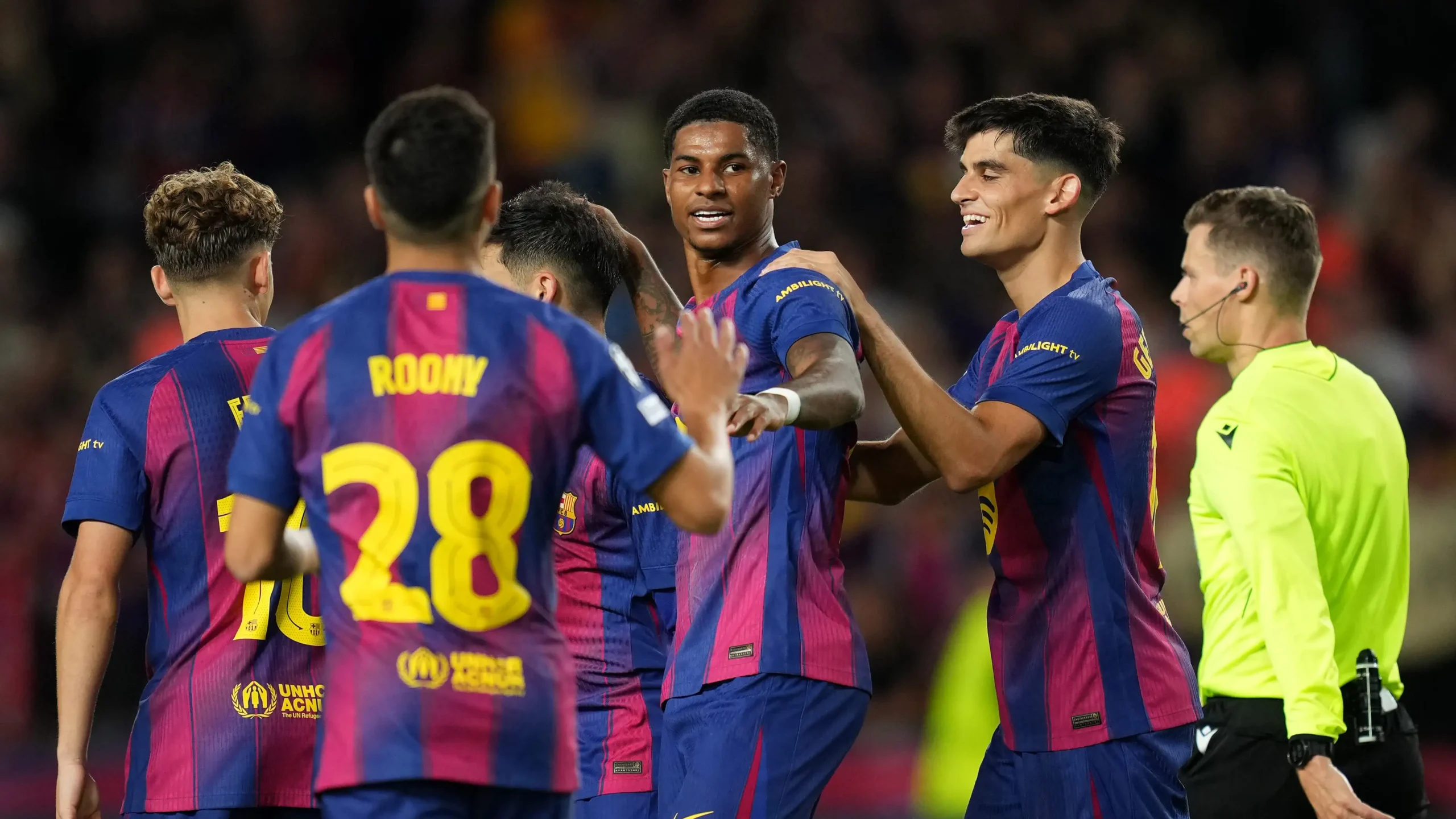Marcus Rashford celebrating a goal for Barcelona against Olympiacos in the Champions League