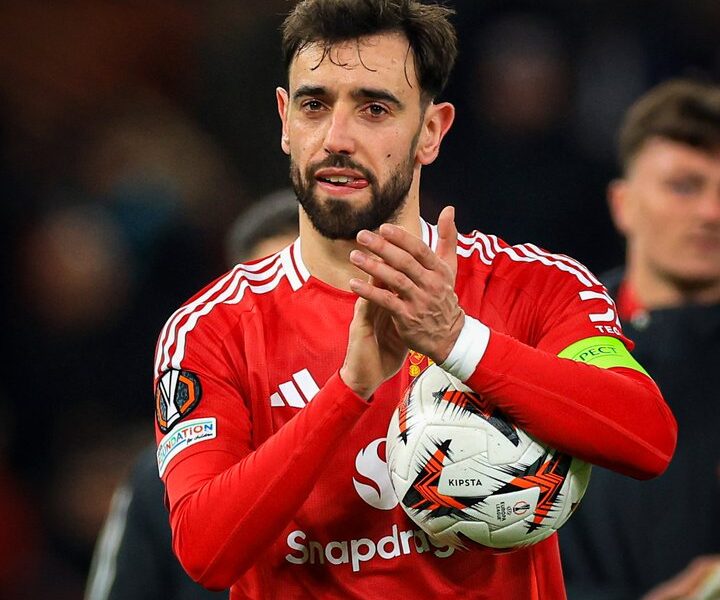 Bruno Fernandes applauding Manchester United fans at Old Trafford