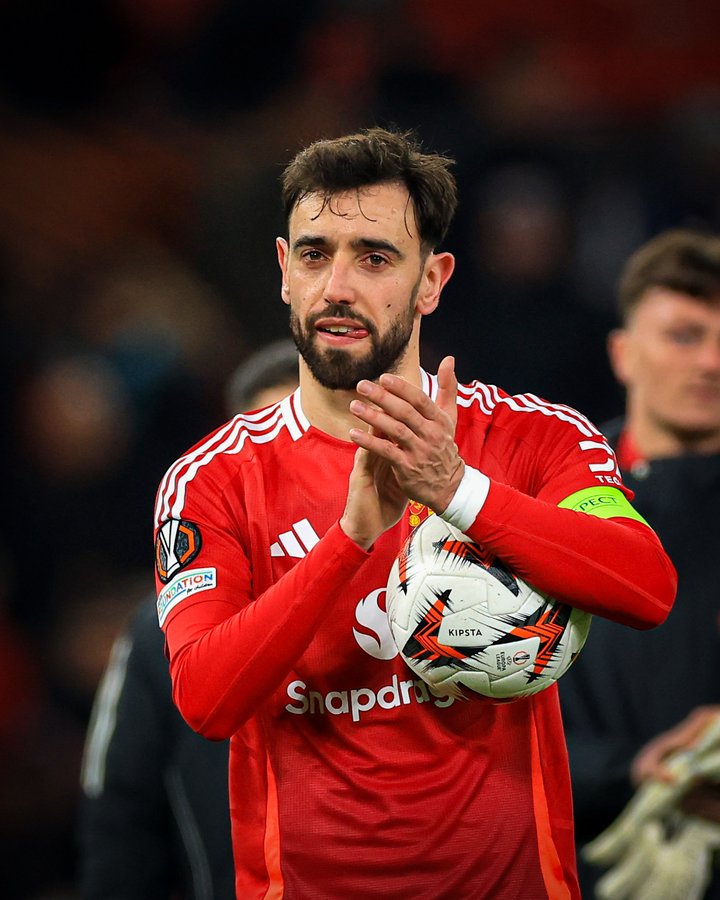 Bruno Fernandes applauding Manchester United fans at Old Trafford