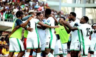 William Troost-Ekong celebrating with Super Eagles teammates after victory against Benin Republic