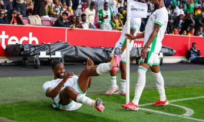 South Africa Sport Minister Gayton McKenzie Speaking At A Press Event While Nigerian Fans Cheer