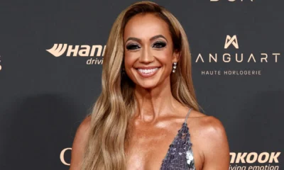 Kate Scott laughing with Micah Richards, Jamie Carragher, and Thierry Henry on CBS Sports set