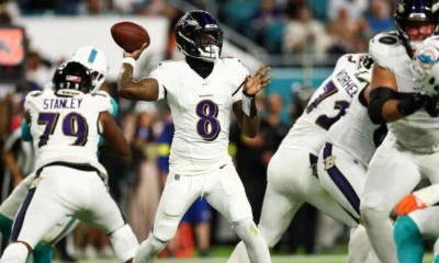 Lamar Jackson celebrating after throwing a touchdown pass in the Baltimore Ravens’ win over the Miami Dolphins.
