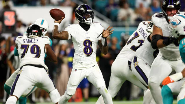 Lamar Jackson celebrating after throwing a touchdown pass in the Baltimore Ravens’ win over the Miami Dolphins.