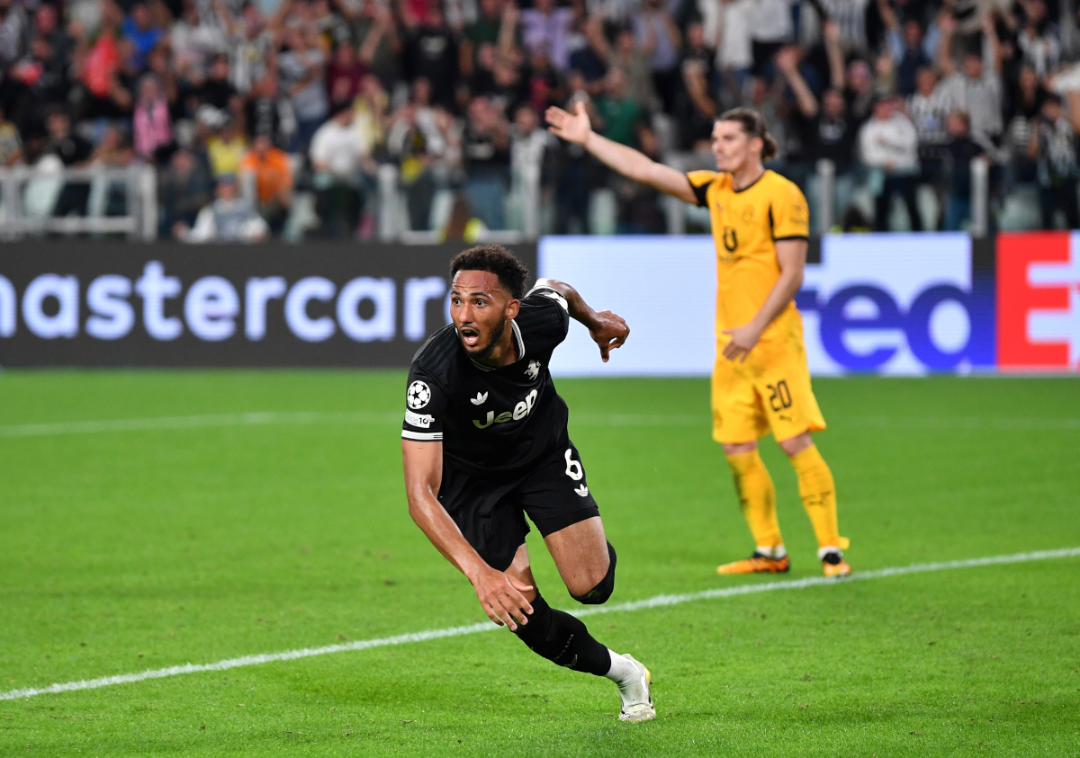Lloyd Kelly celebrates after scoring for Juventus in the Champions League.