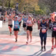 Marathon runners competing under hot conditions during a global race affected by rising temperatures