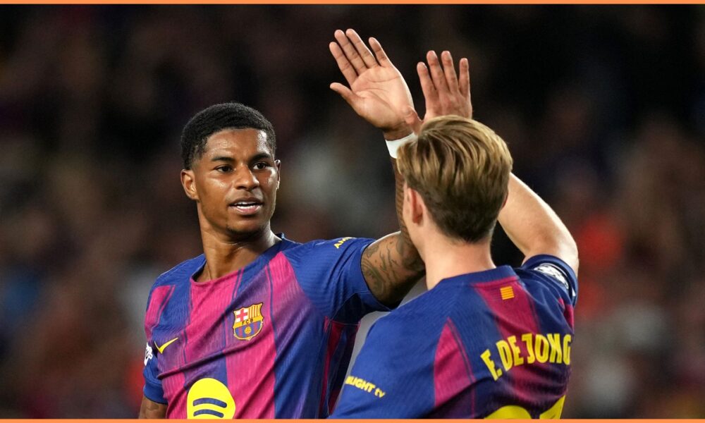 Marcus Rashford celebrating after scoring for Barcelona in the UEFA Champions League.
