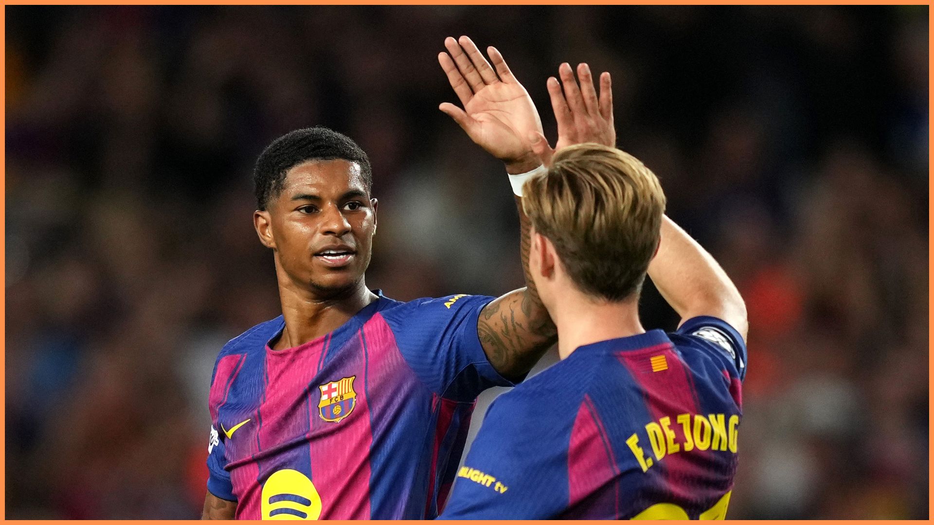 Marcus Rashford celebrating after scoring for Barcelona in the UEFA Champions League.