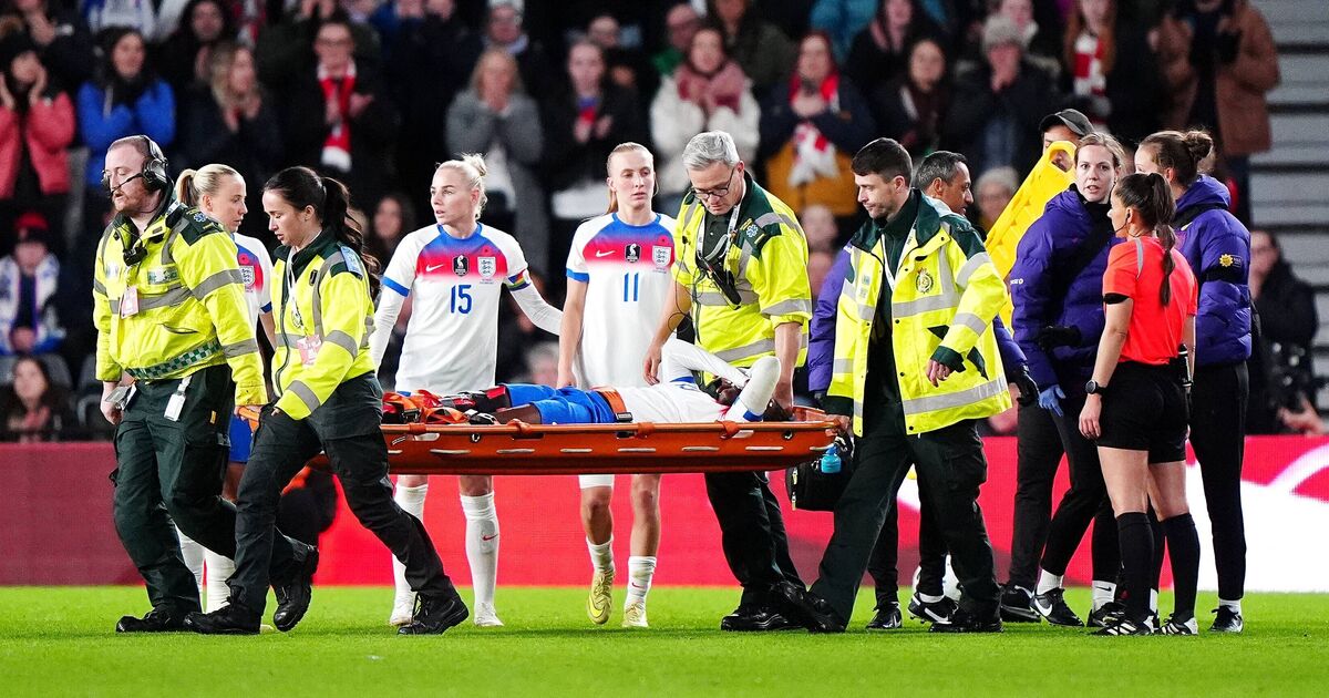 Michelle Agyemang of England being stretchered off during a match against Australia after suffering a knee injury