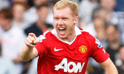Paul Scholes smiling during a football match, Manchester United legend
