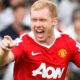 Paul Scholes smiling during a football match, Manchester United legend