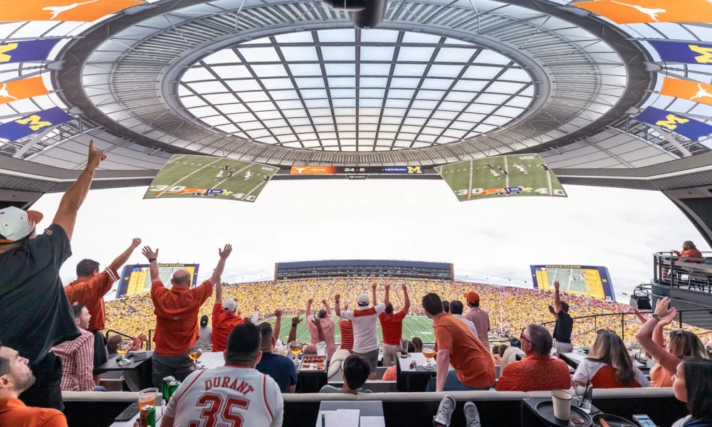 Sports fans cheering in a stadium, representing the global sports market and fan culture.