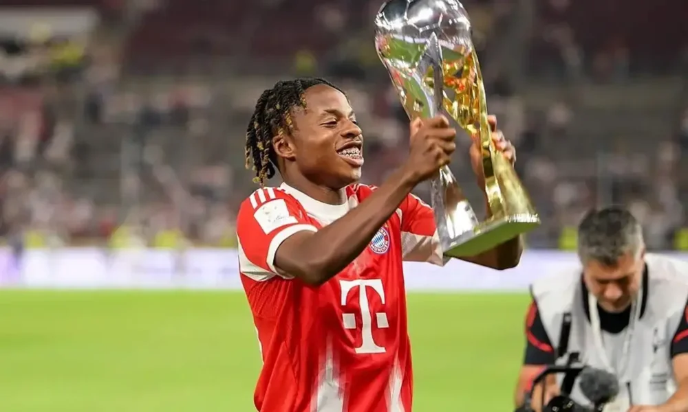 Wisdom Mike celebrates after making his Champions League debut for Bayern Munich