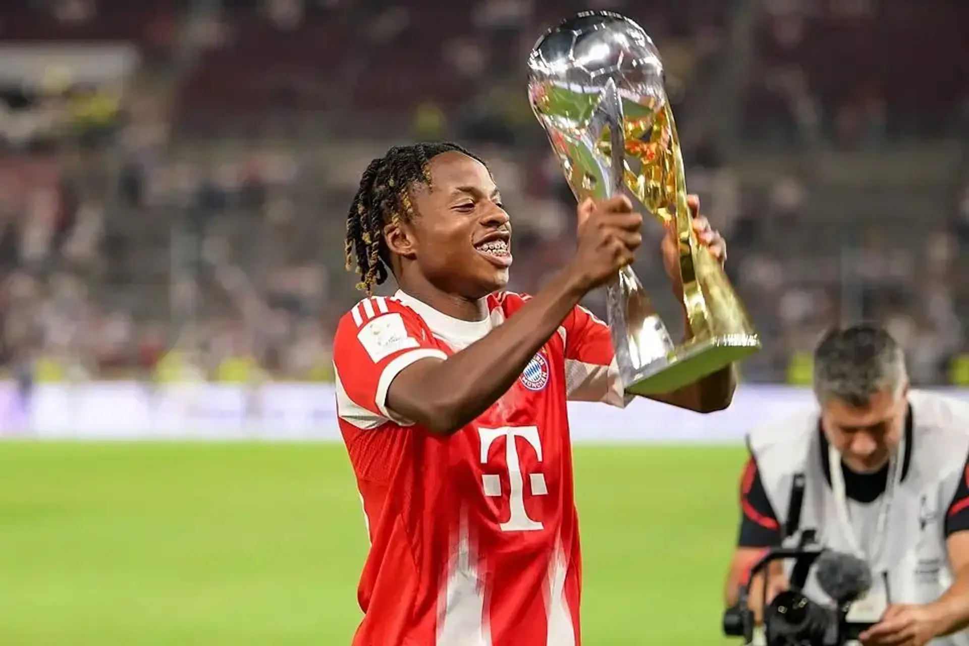 Wisdom Mike celebrates after making his Champions League debut for Bayern Munich