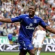 Yakubu Aiyegbeni celebrating after scoring a Premier League goal during his Everton career.