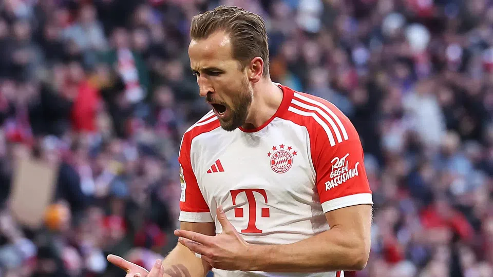 Harry Kane celebrating a goal in Bayern Munich colours during a Bundesliga match