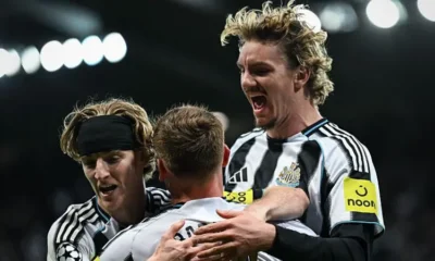 Anthony Gordon celebrates scoring for Newcastle United against Benfica in the Champions League.