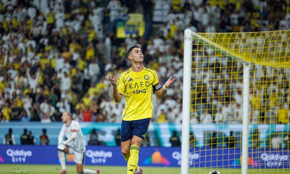 Cristiano Ronaldo celebrating a goal for Al-Nassr as Carlo Ancelotti praises his pursuit of 1,000 career goals
