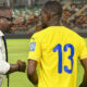 Gabon national team coach Thierry Mouyouma giving instructions during a match.