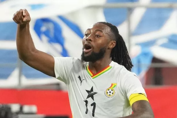 Ghana Black Stars player Antoine Semenyo wearing a “Qualified” shirt celebrating World Cup progress