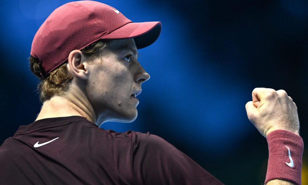 Jannik Sinner celebrates after defeating Felix Auger-Aliassime in his opening ATP Finals match in Turin.