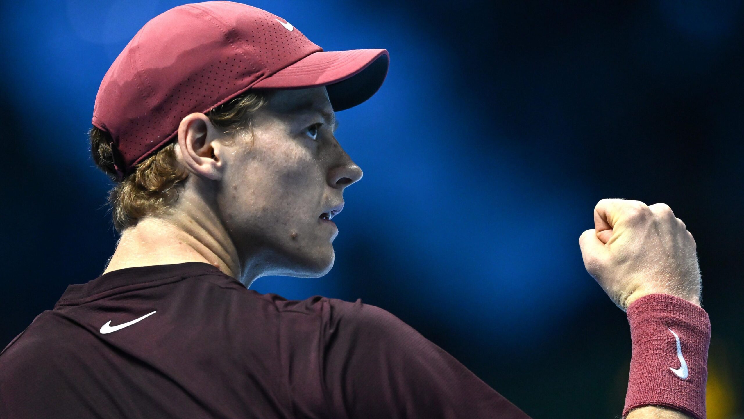 Jannik Sinner celebrates after defeating Felix Auger-Aliassime in his opening ATP Finals match in Turin.
