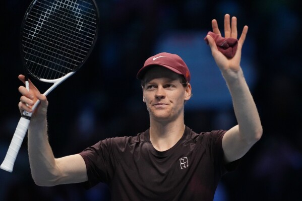 Jannik Sinner celebrates victory over Alexander Zverev at the ATP Finals in Turin.