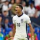 Jude Bellingham celebrating after scoring for England during an international match