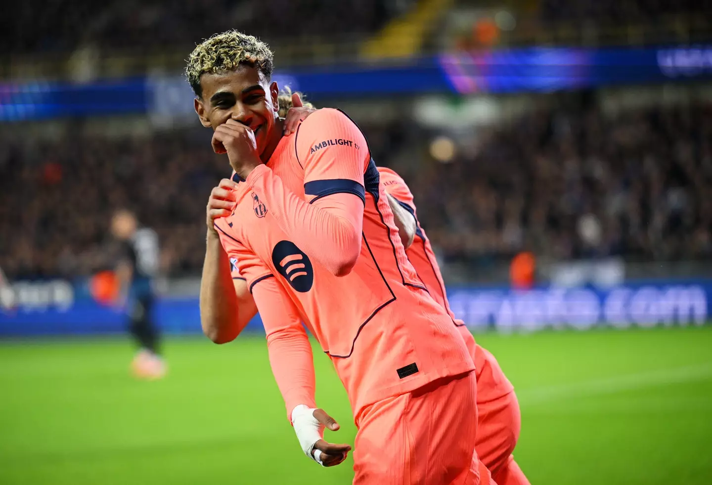 Lamine Yamal celebrating with Barcelona badge ahead of Camp Nou return