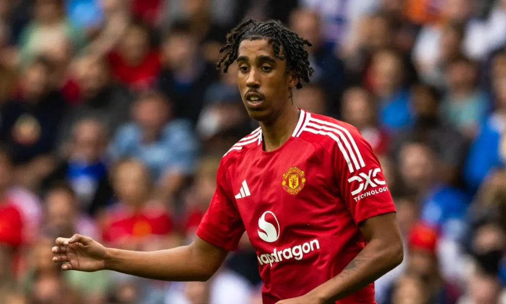 Leny Yoro applauds during a Manchester United match under Ruben Amorim