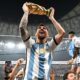 Lionel Messi holding World Cup trophy after Argentina’s 2022 victory