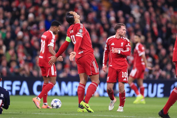 Liverpool players looking dejected after conceding against PSV in the Champions League