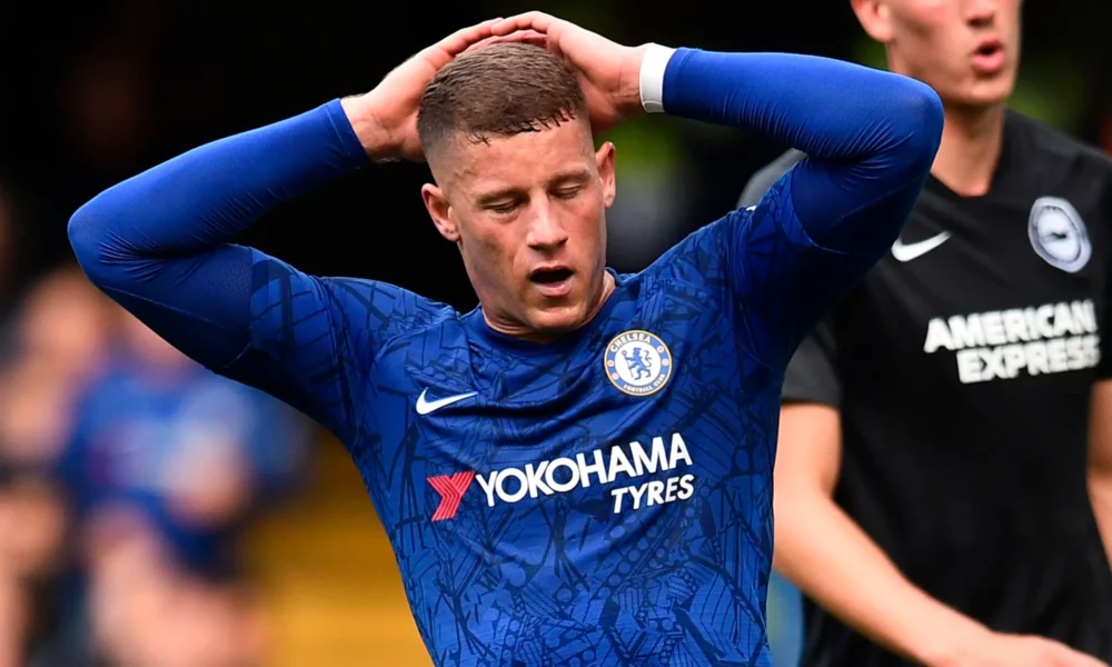 Ross Barkley in a Chelsea jersey looking dejected during a Premier League match at Stamford Bridge.