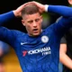 Ross Barkley in a Chelsea jersey looking dejected during a Premier League match at Stamford Bridge.